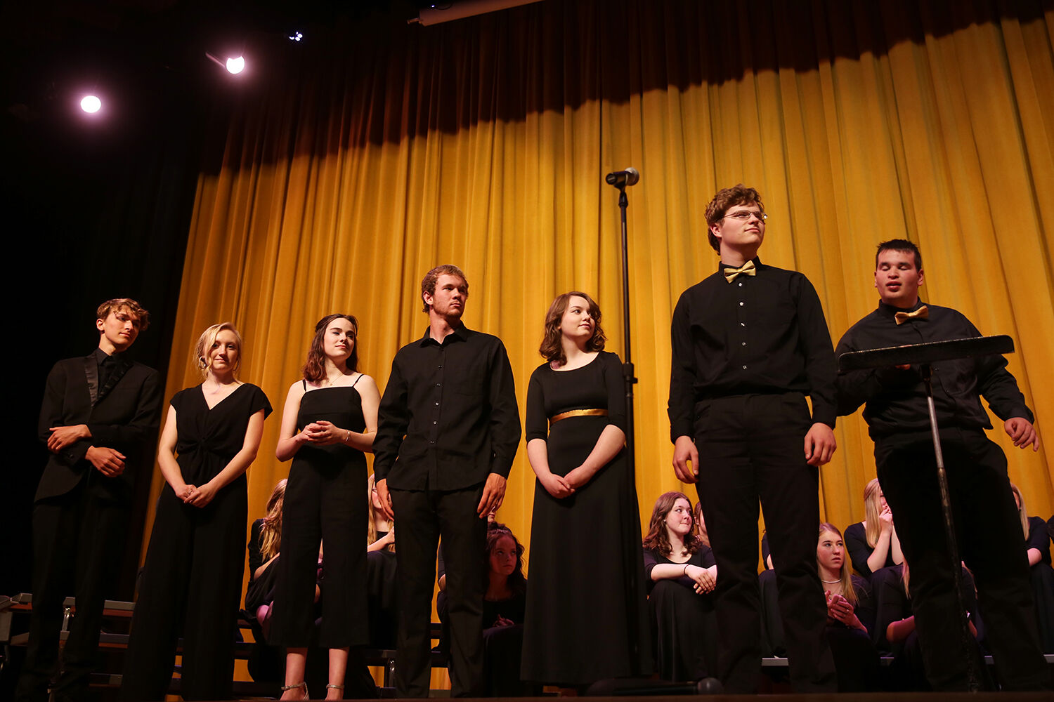 Senior choir members join together on stage